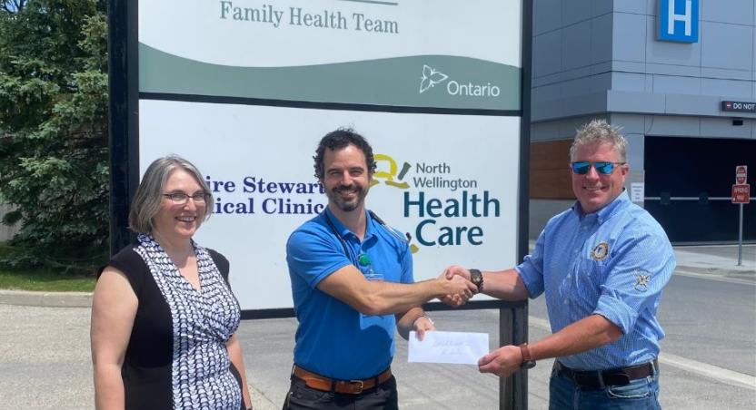 Coun. Steve McCabe presents a $10,000 grant/cheque to support Health Care Recruitment initiatives to Dr. Alex Goytisolo and Mount Forest Family Health Team Executive Director Suzanne Trivers in June 2022.