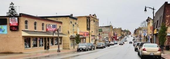 A street with storefronts extending into the background