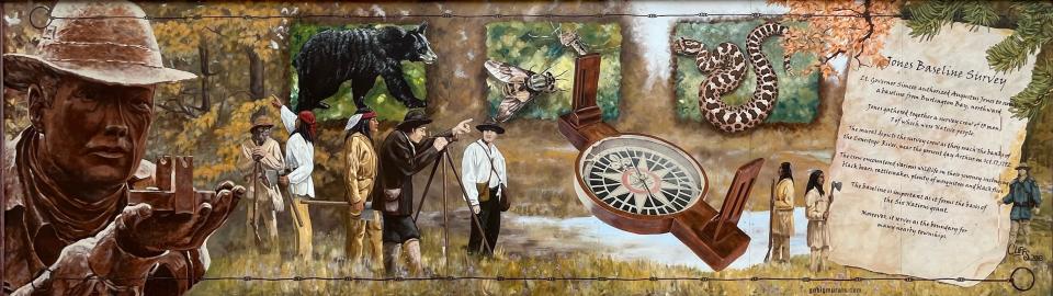 A mural of the Jones Baseline Survey, which resides on the side of a building in downtown Arthur.