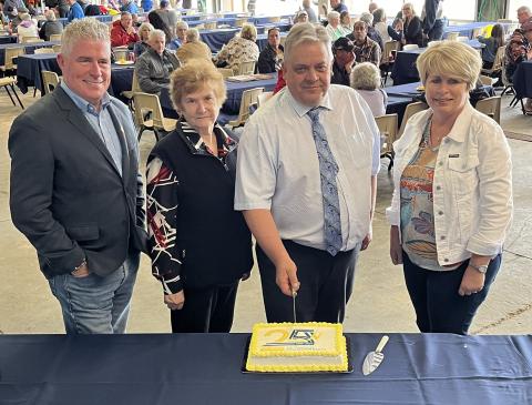 Members of Council cutting the cake at the Township of Wellington North's 25th Anniversary Celebration on Friday, June 7, 2024. Pictured, from left: Coun. Steve McCabe, Coun. Penny Renken, Mayor Andy Lennox, Coun. Sherry Burke. Absent: Coun. Lisa Hern.